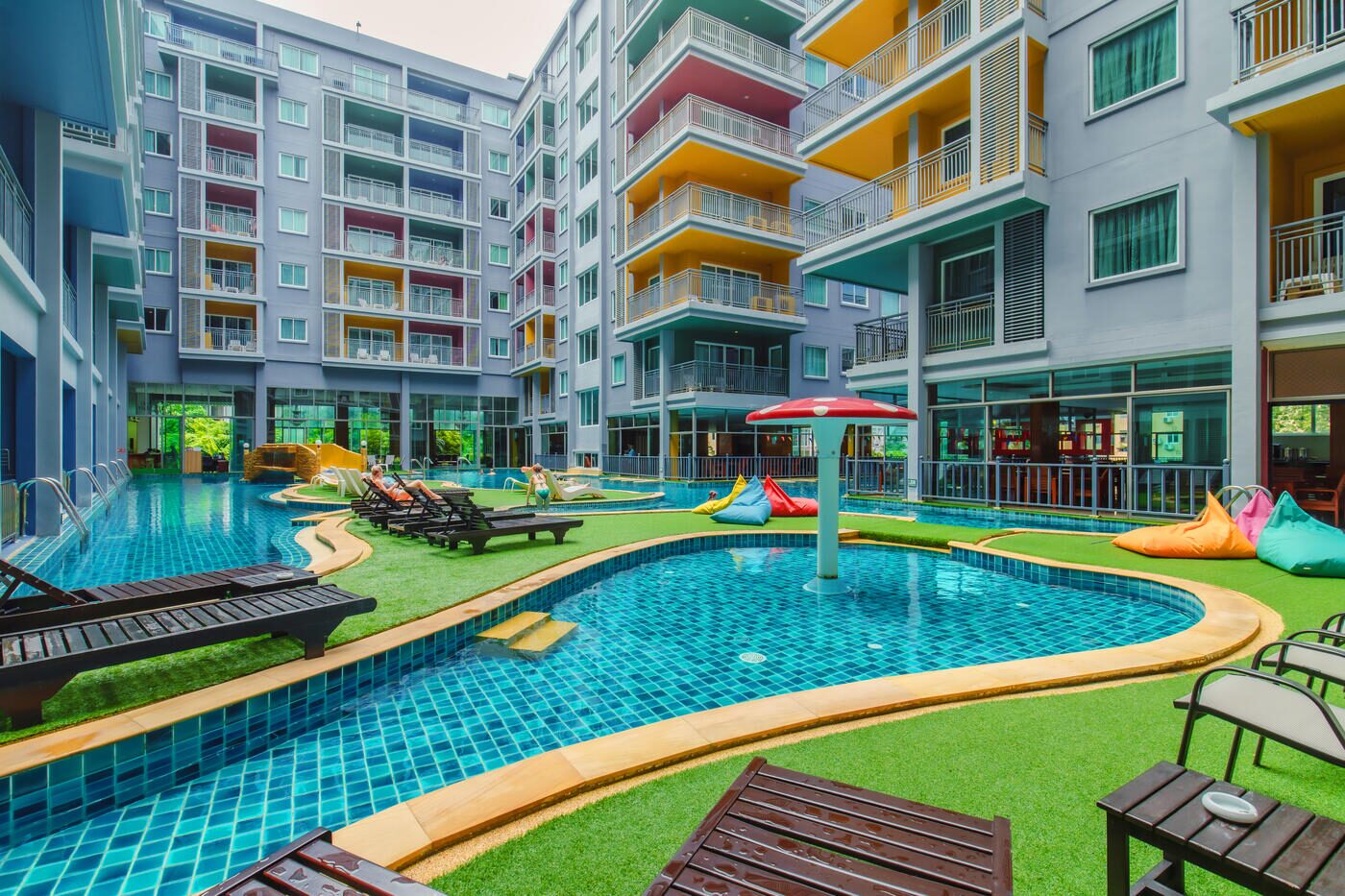 Outdoor lagoon pool and Jacuzzi at Elite Suites Patong